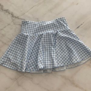 Plaid baby blue and white skirt. For playing tennis or just to look cute.